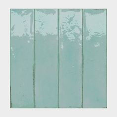 an abstract painting with green paint on the wall and vertical lines drawn across it in different directions