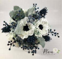 a bridal bouquet with white and blue flowers