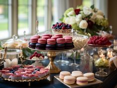 a table topped with lots of desserts and pastries