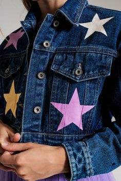 Elevate your denim game with our Crop Denim Jacket adorned with Multicolored Stars. Crafted from 100% cotton, this jacket is not only stylish but also comfortable. The model, standing at 5'8'' with measurements 33-24-35, showcases size S, ensuring a true-to-size fit. This jacket offers a relaxed fit with a cropped length, making it perfect for daily wear. The playful multicolored stars add a touch of uniqueness to your outfit, setting you apart from the crowd. The classic polo collar and long sl Trendy Denim Jacket, Eras Outfit, Crop Denim Jacket, Trendy Denim, Blue Denim Jacket, Cropped Denim Jacket, Denim Jacket Women, Fit Check, Cropped Denim