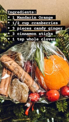 the ingredients for an orange christmas tree ornament in a bag on top of a pine tree