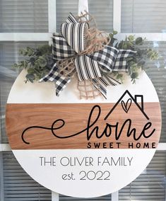 a wooden sign that says home sweet home with a bow on it and the words, the oliver family est 2092