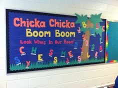 two children's signs on the wall in front of their desks at school