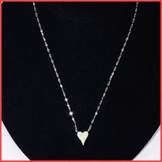 A slightly elongated sterling silver or gold vermeil heart, covered with extremely sparkly cubic zirconia pavé, hangs fixed on a unique and delicate sterling chain. The heart is 1/2" long and 3/8" wide. The chain is 14-16" long with extender and a lobster clasp. Available in silver or gold vermeil. Imported for the Leila Jewels Glam Collection. Gold Heart Necklace, Silver Heart Necklace, Heart Necklace, Gold Vermeil, Lobster Clasp, Silver Gold, Cubic Zirconia, Sterling Silver, Chain