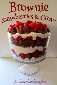 brownie, strawberries and cream trifle in a glass dish