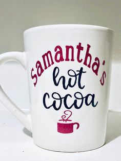 a white coffee mug with the words samantana's hot cocoa on it