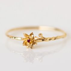 These unique solid gold birth month flower rings feature delicate and detailed flowers set with each month's birthstone. Discover this new take on personalized birth month jewelry. Rings With Birthstones, January Carnation, Affordable Fine Jewelry, Flower Rings, Gold Flower Ring, Local Eclectic, Birth Month Flower, Gold Rings Fashion, Birth Flower