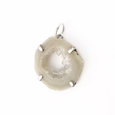 "This one of a kind pendant is made with a slice of natural occo agate with tiny Quartz crystal druzy. They are completely natural, agatized and covered in stunning quartz crystals in the center. This unusual gem is a soft beige color with clear crystals. The occo druzy is prong set in Sterling silver and measures 1\" inch. The entire pendant measures 1 1/4\" inches in length. The pendant bale is 1/4\" inch (6mm). If you would like this pendant as a necklace, you can purchase it with a necklace Silver Agate Geode With Natural Stones, Handmade Silver Agate Geodes, Silver Agate Geodes For Gift, Silver Agate Geode As A Gift, Silver Agate Geodes, Silver Agate Geodes As A Gift, Large Agate Geode For Spiritual Purposes, Large Agate Geode For Spiritual Use, Healing Silver Geodes With Natural Stones