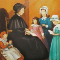 an image of a woman reading to children