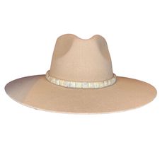 Add a classic touch to your cowboy hat with our hand-crafted pearl beaded hat band. This hat band features pearl square beads that adorn the center of the leather band. Crafted from the finest North American deer hides, this hat band is soft, strong, and supple. Due to the self-tie nature of this hat band, it can be adjusted to best fit every cowboy hat in your collection. You can customize this hat band further to your preference by selecting your favorite color of leather band from those offer Pearl Hat, Beaded Hat Bands, Hat Bands, Deer Hide, Beaded Hat, Square Beads, Square Bead, Deer Skin, Hat Band