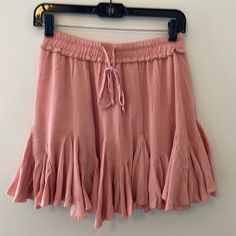 Mid Waist Pink Ruffle Skirt, Brand New With Tags. Elastic Bank With An Adjustable Tie. Flowy And On The Shorter Side. Purchased From A Small Boutique In Nc. Casual Flowy Ruffled Skirt, Flowy Skirted Bottoms With Ruffle Hem, Casual Flowy Skirt With Ruffle Hem, Flowy Casual Skirt With Ruffle Hem, Flowy Flared Skirt With Ruffle Hem, Casual Stretch Skirt With Ruffle Hem, Stretch Ruffle Skirt For Day Out, Vacation Skirt Bottoms With Ruffle Hem, Vacation Skirt With Ruffle Hem