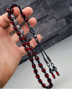 *Powdered amber rosary is a product that can be used for decorative purposes at the home, office, etc. *Muslims can use it during tasbihat after prayer. *All tassels' upper is alpaca material and inside is bead. Alpaca material is coated with 2-3 micron silver. *The inside of the letters is bead and the upper is alpaca material. Alpaca material is coated with 2-3 micron silver. *All products are sent free of charge in a wooden box.  *Special leather box is chargeable. Material: *Powdered Amber V Traditional Handmade Rosary Bracelet With Round Beads, Traditional Handmade Rosary Bracelet, Artisan Amber Beads For Gift, Traditional Rosary Bracelet With 8mm Beads As Gift, Traditional Rosary Bracelet With 8mm Beads, Handmade Spiritual Rosary With Oval Beads, 8mm Oval Beads For Gifts, Polished Round Beads Rosary As Gift, Hand-strung Round Beads Rosary As A Gift