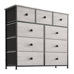 a white and black dresser with drawers