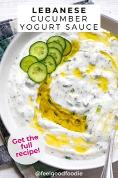 a white plate topped with cucumber yogurt sauce