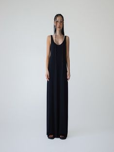 A maxi length Tencel Spandex blend sleeveless dress. Stunning backless design with scoop detail. Model is in MINUSEY ONE SIZE. ✔️ Free worldwide express shipping over $100✔️ Loved by 6,500+ customers✔️ Limited edition collections, maximum styleStay ahead of the trend with can’t-find-anywhere-else staples. Your closet will thank you 💕 * MINUSEY ONE SIZE = EU 34-38, US 2-6* 96% Tencel / 4% Spandex* Dry clean* Made in Korea - Model Height: 172cm/5'7" (US2, EU34) Stretch Longline Maxi Dress For Summer, Sleeveless Stretch Maxi Dress For Daywear, Stretch Sleeveless Maxi Dress For Daywear, Black Longline Maxi Dress For Summer, Black Sleeveless Floor-length Dress For Summer, Black Floor-length Sleeveless Dress For Summer, Backless Design, Leather Dresses, Denim Bag