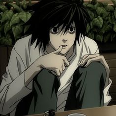 an anime character sitting at a table with his finger on his chin and looking off to the side