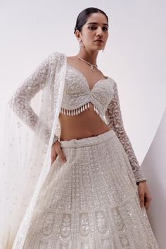 Ivory attached cancan lehenga with all over floral, sequins and pearl embellishments in jharokha, geometric pattern. Paired with a padded blouse with all over floral, sequin, pearl embellishments and dupatta. - Aza Fashions White Fitted Lehenga For Ceremony, Fitted White Choli For Ceremony, White Fitted Choli For Ceremony, Fitted Wedding Lehenga With Lace Work, Elegant Fitted Choli With Lace Work, Elegant Fitted Lace Work Choli, White Choli With Lace Work For Wedding, Off White Choli For Wedding, White Wedding Choli With Lace Work