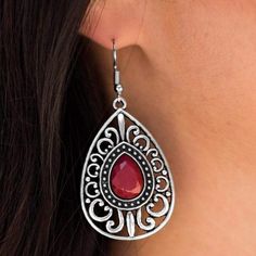 Swirls of silver filigree create an airy teardrop-shaped frame that wraps around a faceted teardrop bead tinted in red. Earring attaches to a standard fishhook fitting. Sold as one pair of earrings. Lead and Nickel Free. Red Dangle Filigree Jewelry, Red Filigree Dangle Jewelry, Red Teardrop Pierced Jewelry, Red Dangle Jewelry With French Hook, Red Elegant Nickel-free Teardrop Earrings, Bohemian Red Teardrop Jewelry, Red Nickel-free Teardrop Earrings, Nickel Free Red Teardrop Earrings, Nickel-free Red Teardrop Earrings