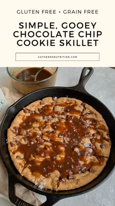 a chocolate chip cookie is in a cast iron skillet with the words gluten free and grain free