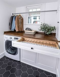 a washer and dryer in a small room