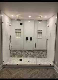 a walk in shower sitting inside of a bathroom