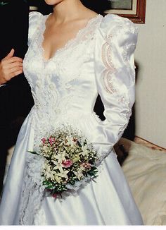 a woman in a wedding dress holding a bouquet