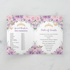 wedding seating cards with pink and purple flowers