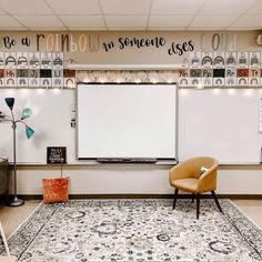 a room with two whiteboards on the wall