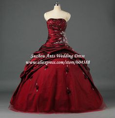 a red ball gown with beading on the skirt