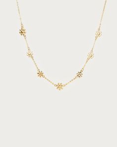 Daisy Necklace
| En Route Jewelry | En Route Jewelry String Crafts, Daisy Necklace, Gold Designs, Gold Design, Jewelry Plate, Jewelry Care