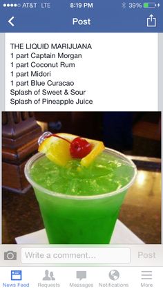 a green drink with a cherry garnish on top