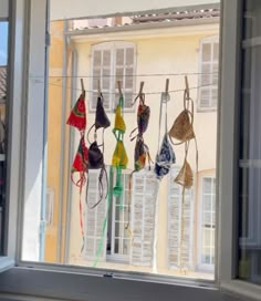 there are many bras hanging outside the window