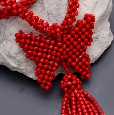 PRODUCT DETAIL : ITEM : CORAL BEADED NECKLACE ITEM CODE : DGC652 ITEM NAME :NECKLACE GEMSTONE : CORAL BEADS SHAPE : SMOOTH BARREL LENGTH : 30 INCH/ 1.75x2.25 INCH ( BUTTERFLY) / 3 INCH TASSEL BEADS SIZE: 7mm APPROX WEIGHT : 385 Cts. APPROX CUSTOMIZATION/BULK ORDER : AVAILABLE PLEASE FEEL FREE TO CONTACT IF YOU REQUIRE ANY FURTHER INFORMATION. Long Beaded Necklace With Tassels As Gift, Beaded Tassel Necklace With Round Beads For Gift, Lariat Beaded Necklace With Tassels For Gift, Gift Lariat Beaded Necklace With Tassels, Tassel Necklace With Round Beads For Gifts, Red Tassel Necklaces For Gifts, Red Tassel Necklaces As Gifts, Red Tassel Necklace For Gift, Beaded Tassel Necklace As A Gift