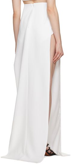 Polyester crepe skirt. · Layered construction · Vented side seams · Darts and zip closure at back · Briefs-style underlay · Full satin lining Supplier color: White Elegant Split Maxi Skirt With Lined Detail, Elegant Split Maxi Skirt With Lining, Formal Spring Maxi Skirt With Side Slits, Spring Formal Maxi Skirt With Side Slits, Spring Party Skirt With Split Hem, Elegant Summer Skirt With Side Zipper, Relaxed Fit Skirt With Side Slits And Split Hem, Elegant Split Skirt With Lining, Elegant Maxi Skirt With Side Slits