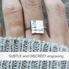 Sterling Silver I Am Enough Statement Ring Have faith in yourself! This subtle, discreet message reminds you that no matter what others say, just remember: 'I AM ENOUGH'. ✅ PRODUCT DETAILS * Material: solid sterling silver. * Square size is 10 x 10 mm and 1.3mm thick. * We use US ring size (please refer to the last picture of the product for the instruction to find your correct US size). ✅ PRODUCTION & SHIPPING INFO 📌 Important: please be aware that the shipping time does not include the pr Meaningful Sterling Silver Promise Ring Engraved, Meaningful Engraved Sterling Silver Promise Ring, Meaningful Promise Ring With Engraving Option, Meaningful Engraved Promise Ring With Engraving Option, Meaningful Sterling Silver Promise Ring, Meaningful Stamped Engraved Promise Ring, Meaningful Engraved Ring For Promise, Engraved Meaningful Promise Rings, Meaningful Name Engraved Promise Ring