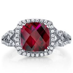 The cherry on top Rubies make everything better, that's why we call them the "cherry on top" gemstone. This versatile ring features a cushion cut Peora created Ruby gemstone in .925 sterling silver. Responsibly sourced in every sense, our created Ruby gemstones are physically, chemically, and optically identical to their natural counterparts. We're big fans of eco-luxury. Handcrafted in pure .925 sterling silver goodness, this ring has been carefully coated in an elegant rhodium finish. Our arti Silver Ruby Ring, Silver Cushions, Blue Topaz Bracelet, Handmade Engagement Rings, Promise Rings For Her, Expensive Jewelry, Ring Crafts, Round Stud Earrings, Pretty Earrings