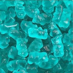 blue gummy bears are piled up together