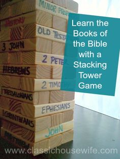 a stack of wooden blocks with the words learn the books of the bible with a matching tower game