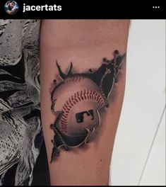 a baseball tattoo on the arm with spikes around it and a ball in the middle