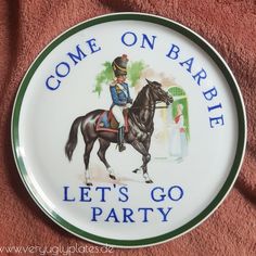 a plate that says, come on barbe let's go party with a horse