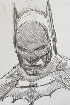 a drawing of the batman in black and white with some color pencils on paper