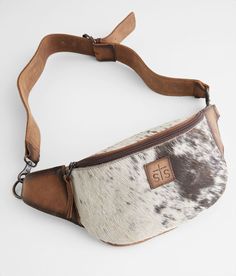 STS Hildy Leather Belt Bag - Cream/Brown , Women's Cowhide Leather and fur fabric lined bag Expect nothing. Appreciate everything. interior graphic Zipper closure Multiple interior compartments Removable strap Dimensions: 8 1/2(L) x 6(H) Due to the natural cowhide there will be a color/pattern variance with each piece. Due to the nature of leather/suede, small variances of color in the skin may occur, this is in no way considered a defect. These are inherent characteristics of leather/suede and Brown Leather Trim Belt Bag For Travel, Luxury Brown Belt Bag With Adjustable Strap, Brown Tote Belt Bag For Travel, Luxury Brown Satchel Belt Bag, Brown Leather Handle Belt Bag For Travel, Brown Belt Bag With Leather Handles For Travel, Brown Leather Belt Bag For Travel, Brown Rectangular Belt Bag With Leather Handles, Brown Leather Trim Pouch Shoulder Bag