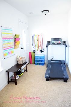 there is a treadmill in the room with other items on the wall and floor