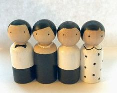 a group of wooden dolls standing next to each other