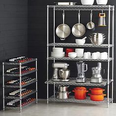 a kitchen shelving unit with pots and pans