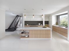 the kitchen is clean and ready to be used as a living room or dining area