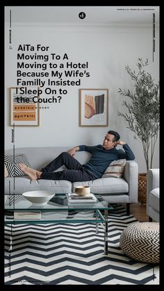 a man laying on top of a couch next to a coffee table