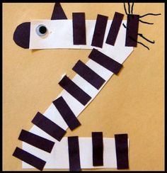 a zebra made out of strips of black and white paper with the words z is for zebra