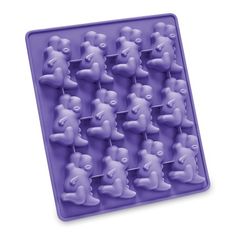 an ice tray with teddy bears in purple frosting on it's sides and one is shaped like a bear