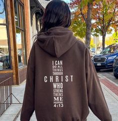 Philippians 4:13 Hoodie I can do all things through Christ who strengthens me. Bible Verse Hoodie Features: ✨50% cotton, 50% polyester ✨ Available in a range of sizes and colors, it's suitable for both men and women. 🎁 Perfect Gift For Christian: Looking for a meaningful gift for a fellow believer? This inspirational hoodie makes for a thoughtful gift for son or daughter, gift for pastor, youth group, baptism gift, or keep for yourself and spread the message of faith, love and hope. Inspirational Letter Print Hoodie For Fall, Inspirational Hooded Sweatshirt For Fall, Inspirational Hooded Fall Sweatshirt, Inspirational Letter Print Hooded Sweatshirt, Inspirational Hooded Sweatshirt With Letter Print, Christian Jackets, Inspirational Hooded Hoodie With Letter Print, Bible Verse Hoodies, Jesus Sweatshirts Hoodies